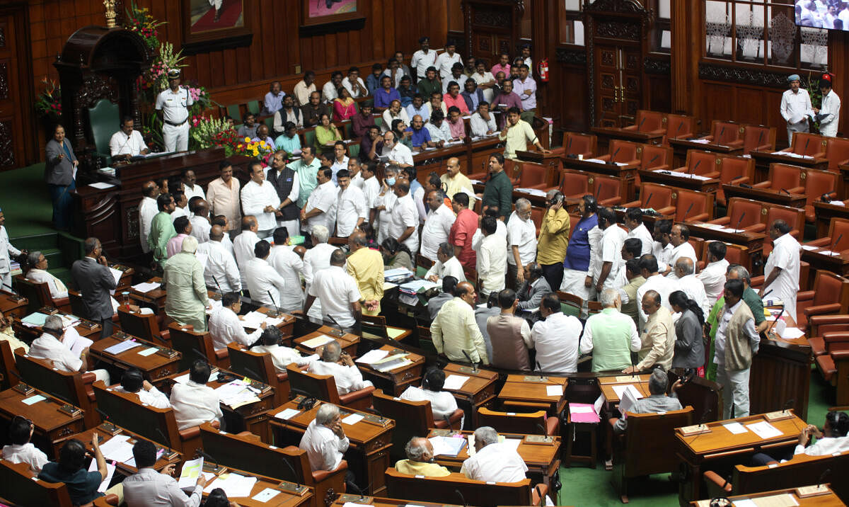 BJP legislators, who criticised the Congress government for "misusing" bureaucrats for a political event, protested by entering the well of the Legislative Assembly on Wednesday. Credit: DH Photo