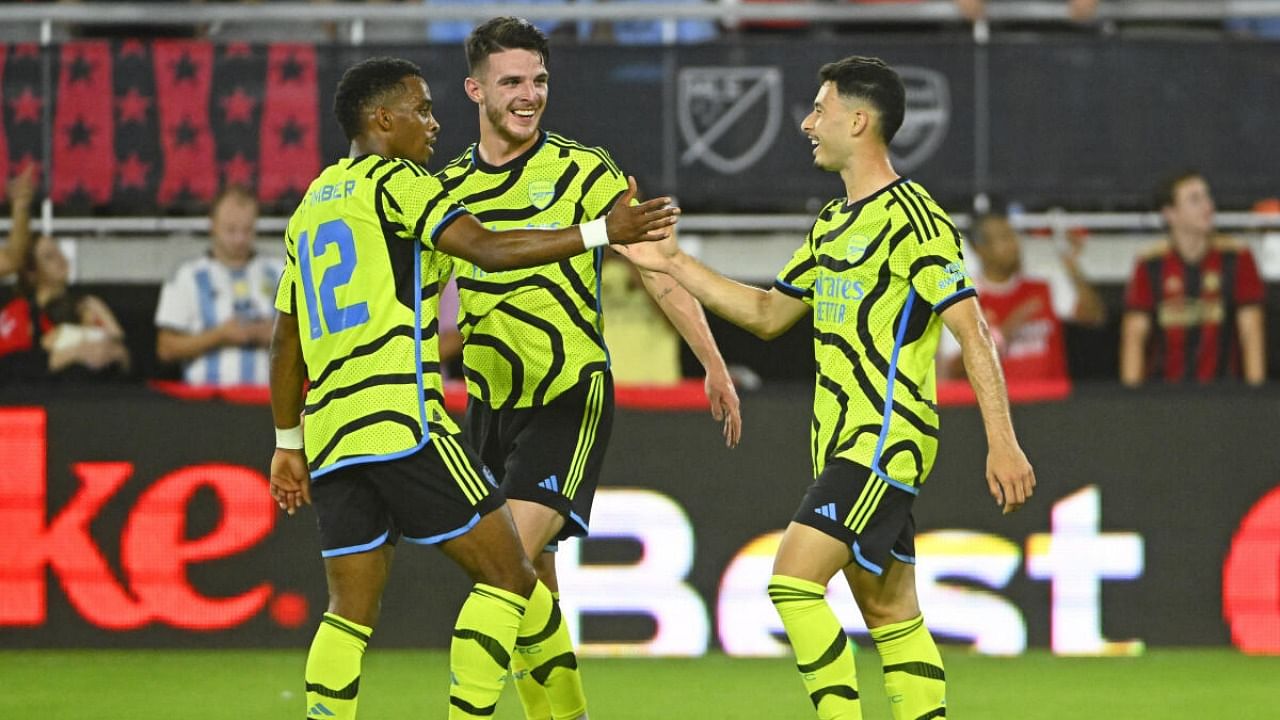 Arsenal forward Gabriel Martinelli (right) and defender Jurrien Timber (12) and midfielder Declan Rice (41) celebrate after a goal against MLS. Credit: USA TODAY Sports via Reuters Con