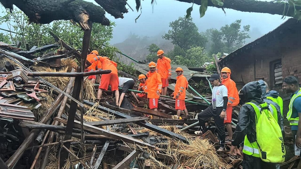 NDRF personnel during a search and rescue operation after a landslide at Irshalwadi village in Raigad district. Credit: PTI Photo