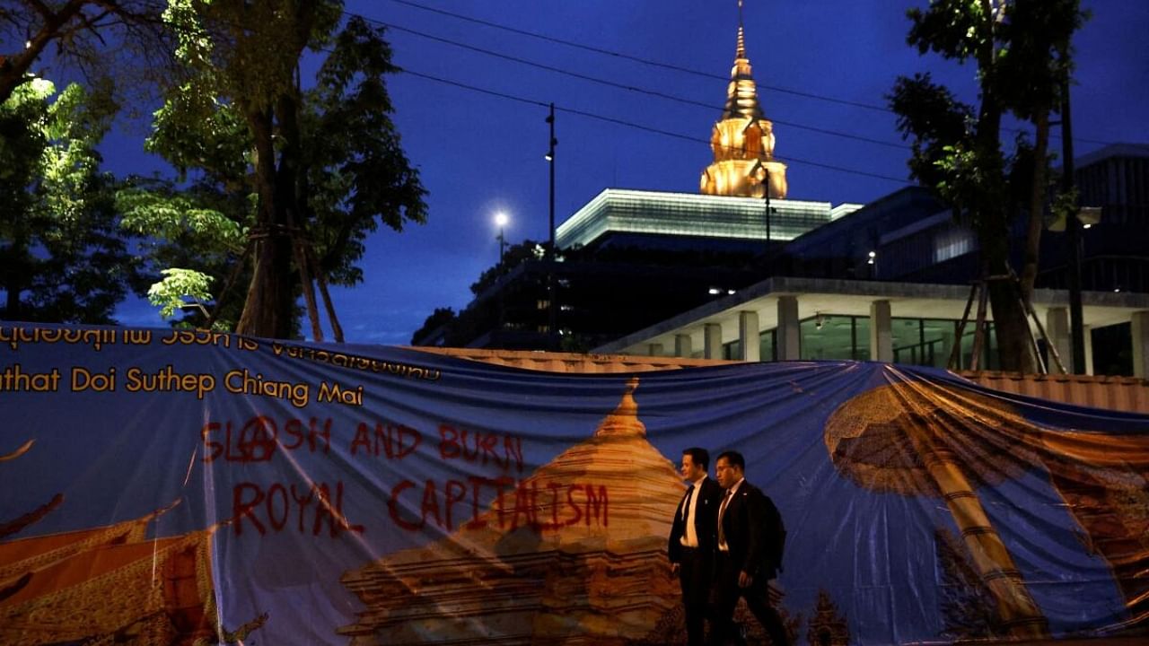 People walk outside the parliament, after Thailand's constitution court ordered the temporary suspension of the Move Forward Party's leader Pita Limjaroenrat from the parliament, in Bangkok, Thailand, July 19, 2023. Credit: Reuters Photo