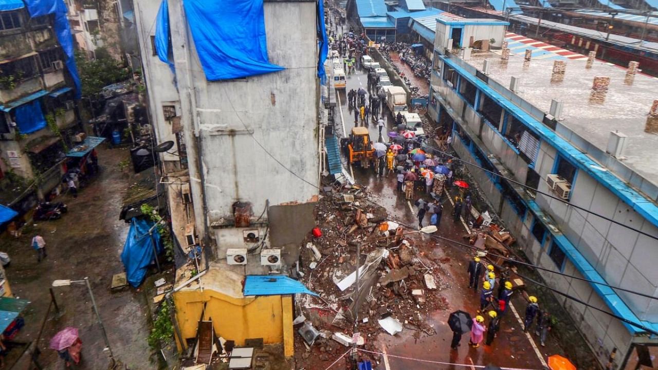 Rescue operation underway after a portion of a building collapsed, near Bhayander railway station in Thane district. Credit: PTI Photo