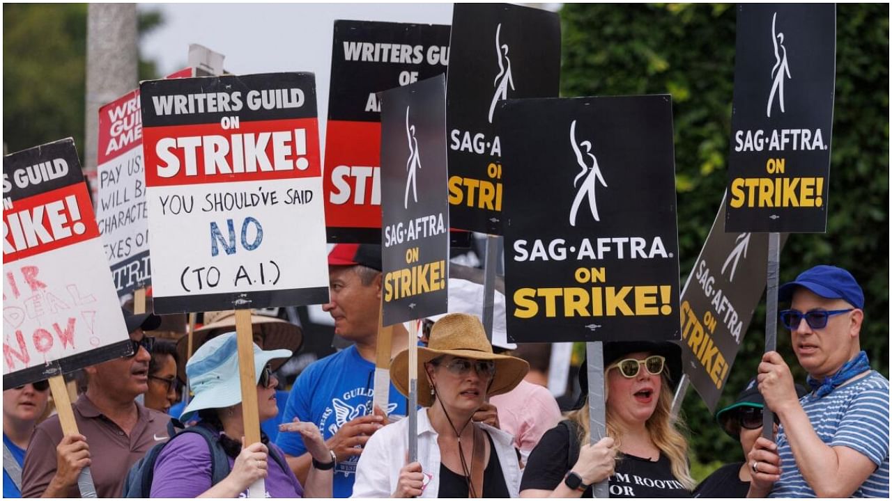 SAG-AFTRA actors and Writers Guild of America (WGA) writers walk the picket line in front of Paramount Studios in Los Angeles, California, US, July 17, 2023. Credit: Reuters Photo