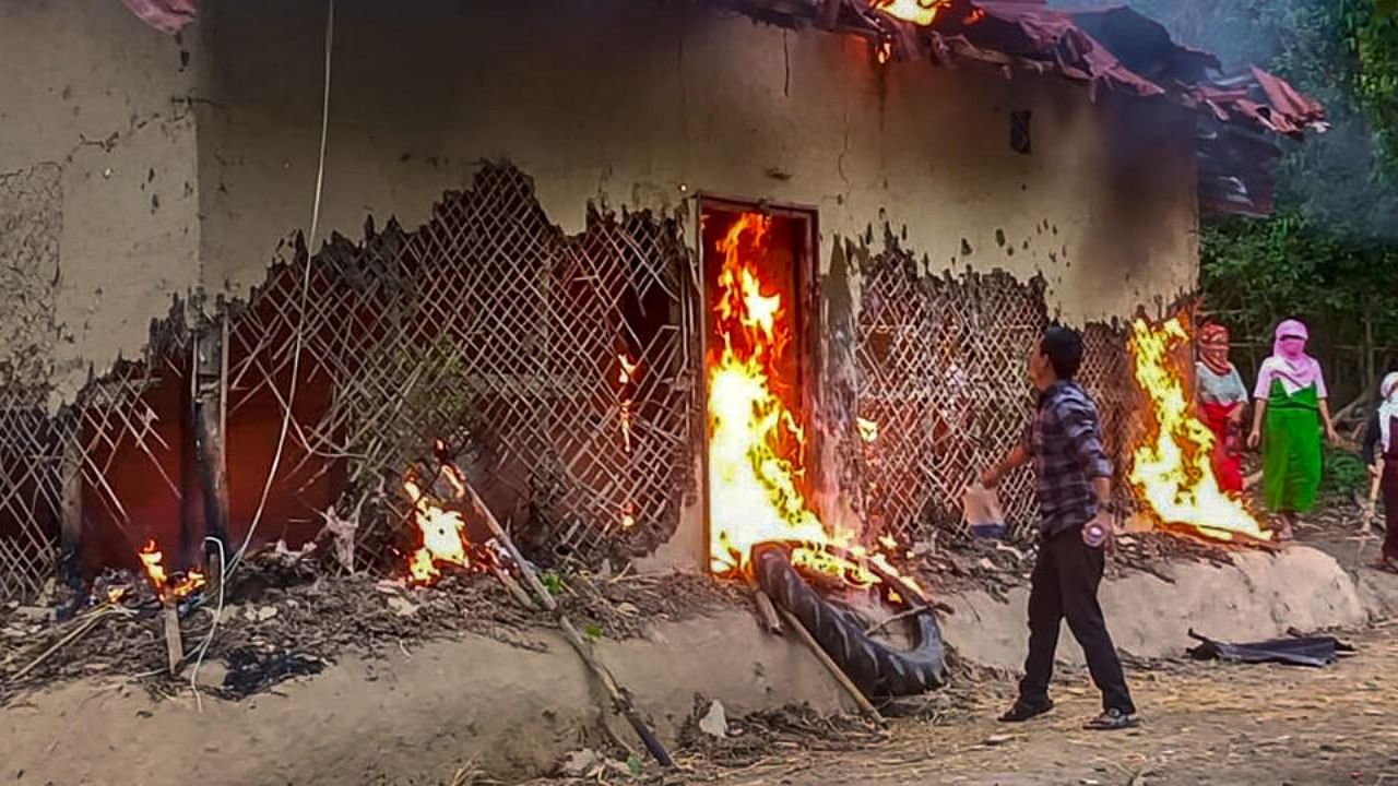 People set ablaze the house of Manipur sexual assault case accused, in Tuinomkhopi, Manipur, Friday, July 21, 2023. Credit: PTI Photo