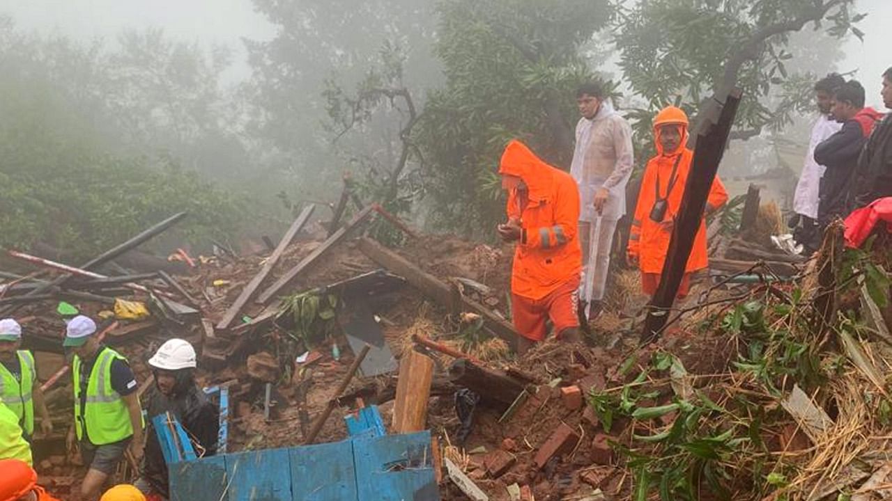 NDRF personnel during a search and rescue operation after a landslide at Irshalwadi village in Raigad district, Friday, July 21, 2023. At least 16 people were killed in the incident, according to officials. Credit: PTI Photo