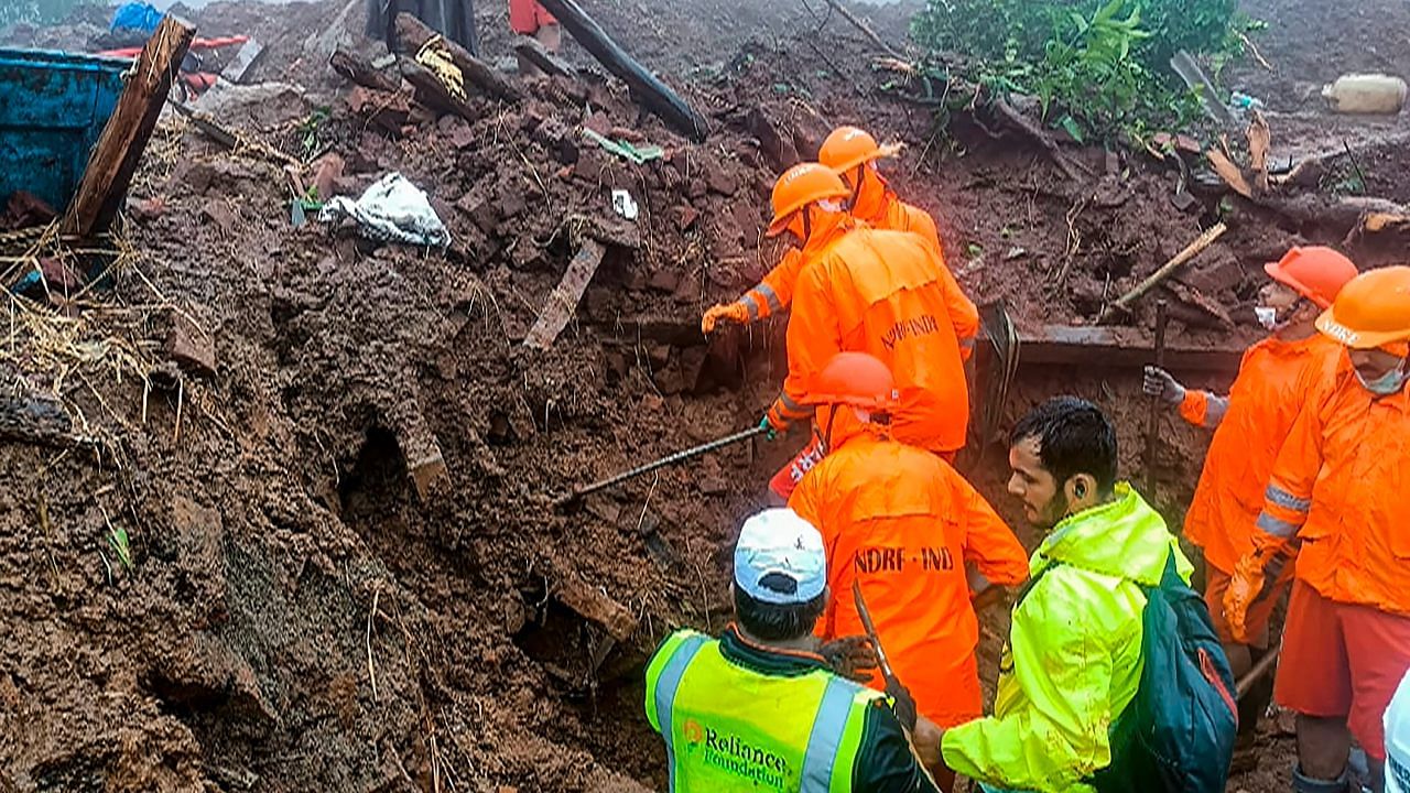 NDRF personnel during a search and rescue operation after a landslide at Irshalwadi village in Raigad district. Credit: PTI Photo