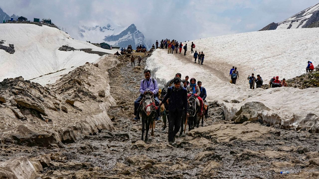  Ponies carry pilgrims at Maha Ganesh Top on their way to the holy cave shrine through Pahalgam route, during Amarnath Yatra 2023. Credit: PTI Photo