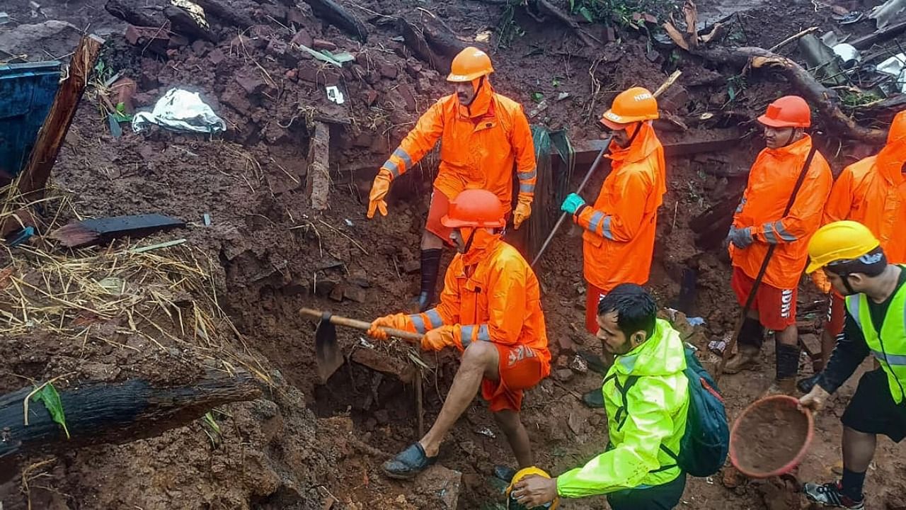 NDRF personnel during a search and rescue operation after a landslide at Irshalwadi village in Raigad district. Credit: PTI Photo