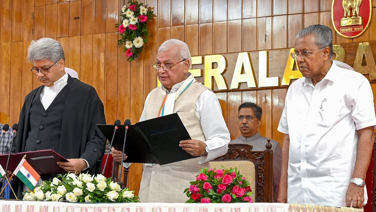Kerala Governor Arif Mohammed Khan administers the oath of office to justice Ashish Jitendra Desai as Chief Justice of Kerala High Court during a ceremony at Raj Bhavan, in Thiruvananthapuram. Credit: PTI Photo