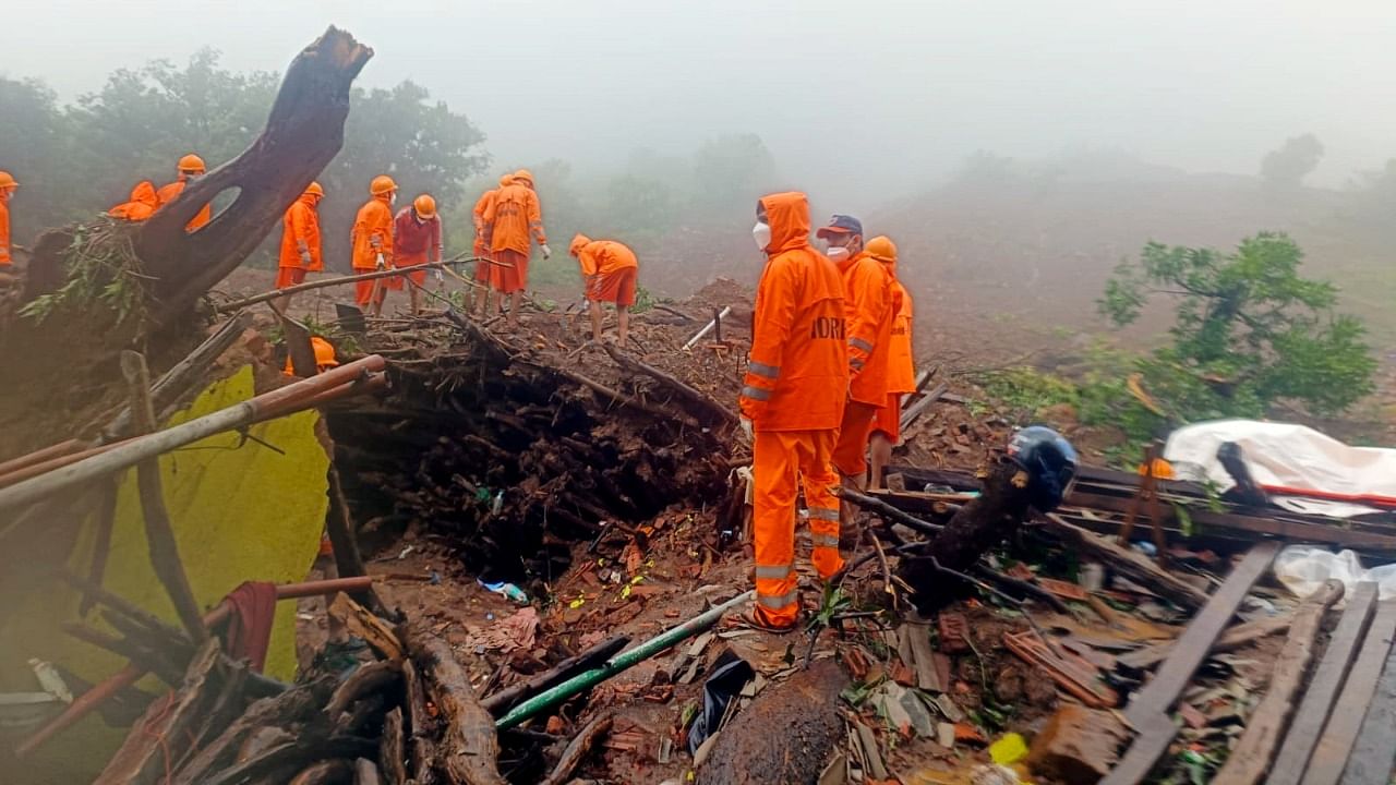 NDRF personnel during a search and rescue operation after a landslide at Irshalwadi village in Raigad district. Credit: PTI Photo