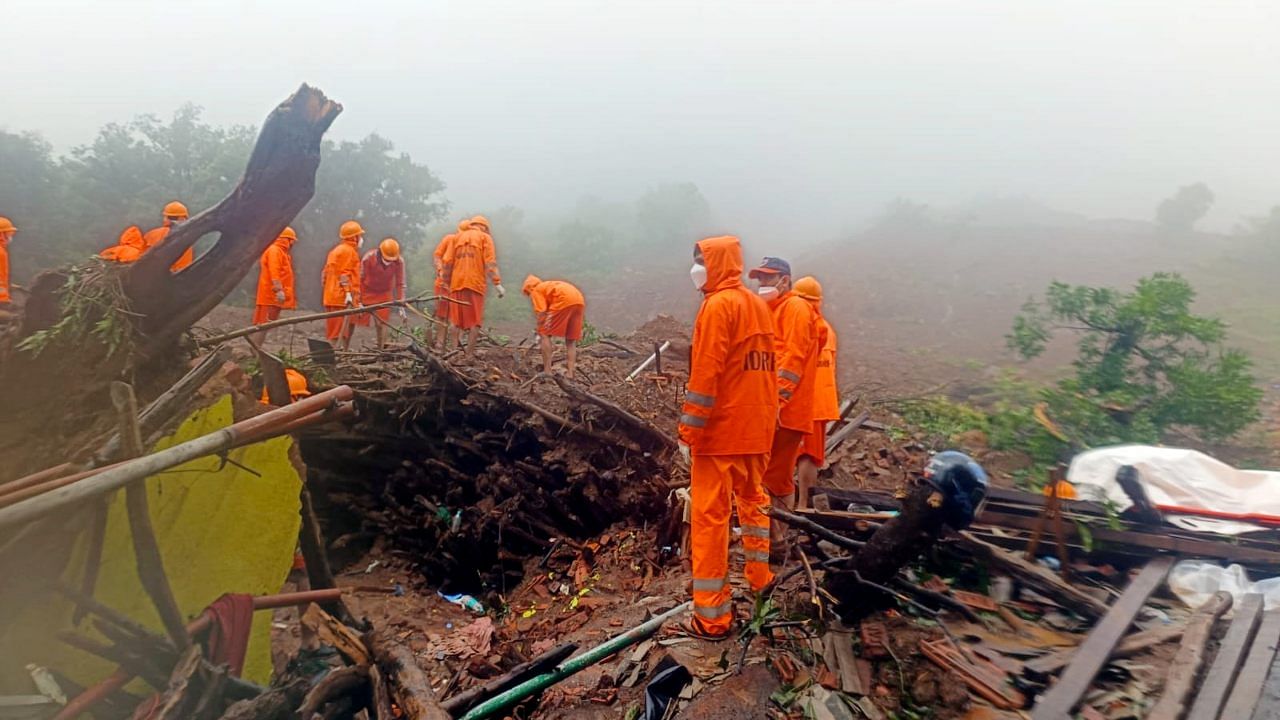 NDRF personnel during a search and rescue operation after a landslide at Irshalwadi village in Raigad district. Credit: PTI Photo