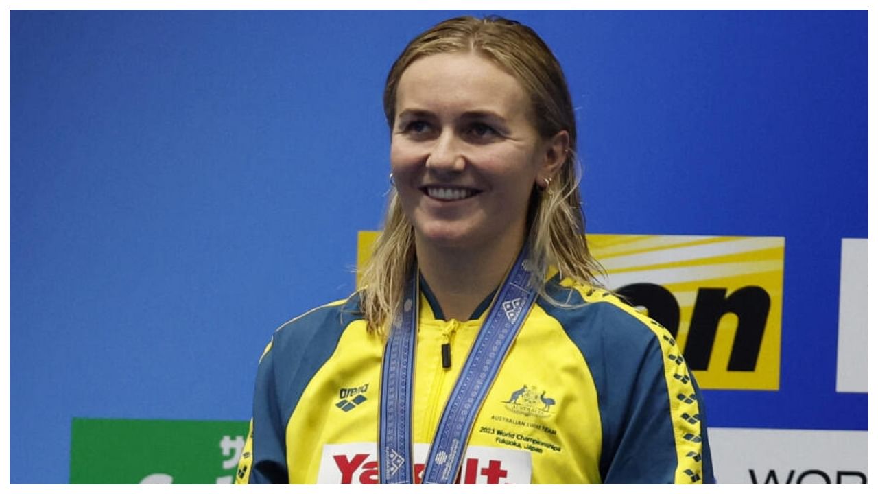 Australia's Ariarne Titmus celebrates on the podium after winning the women's 400m freestyle final. Credit: Reuters Photo