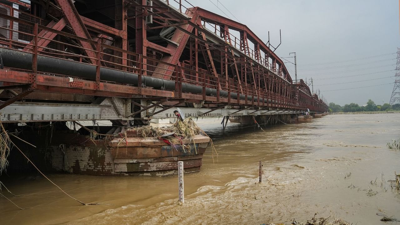 Swollen Yamuna river near the Old Yamuna Bridge (Loha Pul), in New Delhi, Monday, July 17, 2023. PTI Photo