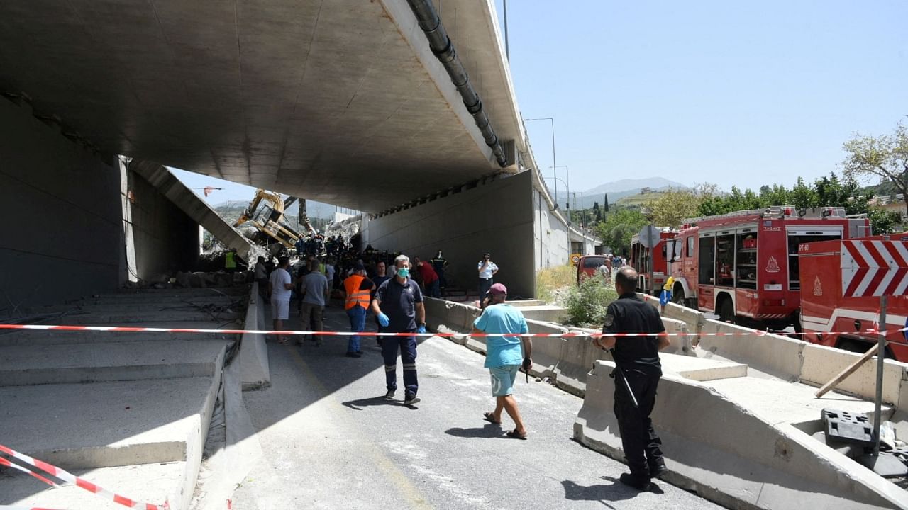 People are seen at the site of a bridge that collapsed in Patras, Greece, July 23, 2023. Credit: Andreas Alexopoulos/Intime News via Reuters Photo