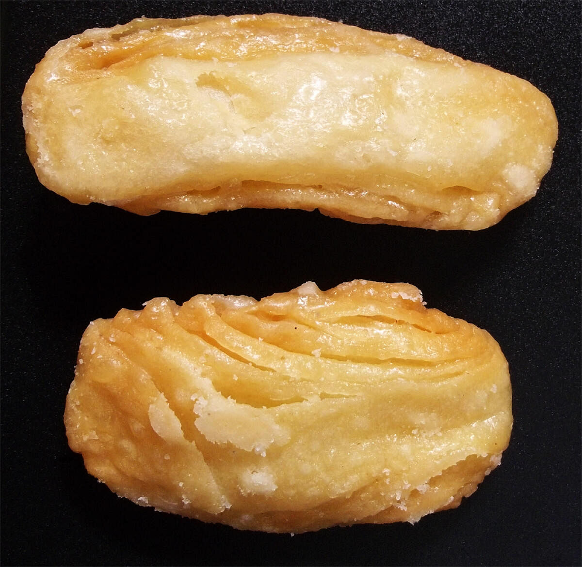 Khaja is a wheat-based, intricately layered, deep-fried crunchy sweet glazed with sugar.