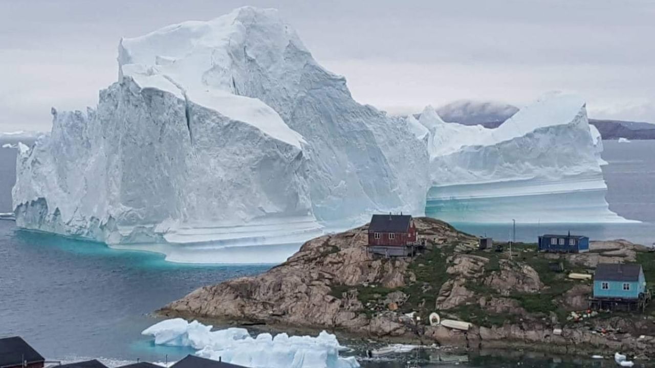 <div class="paragraphs"><p>A giant iceberg seen behind a settlement in Greenland. </p></div>