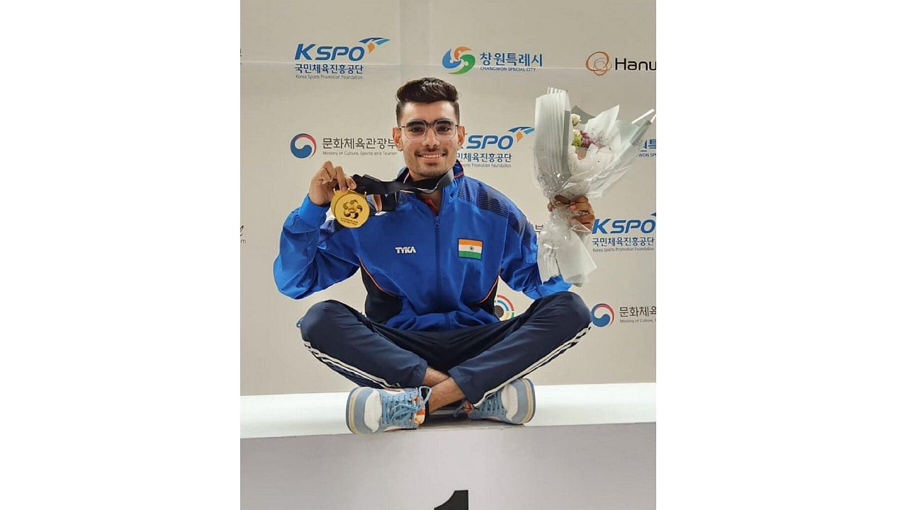 India's Kamaljeet poses for photos after winning the gold medal in men's 50m Pistol event at the ISSF Junior World Championship, in Changwon, South Korea.  Credit: PTI Photo