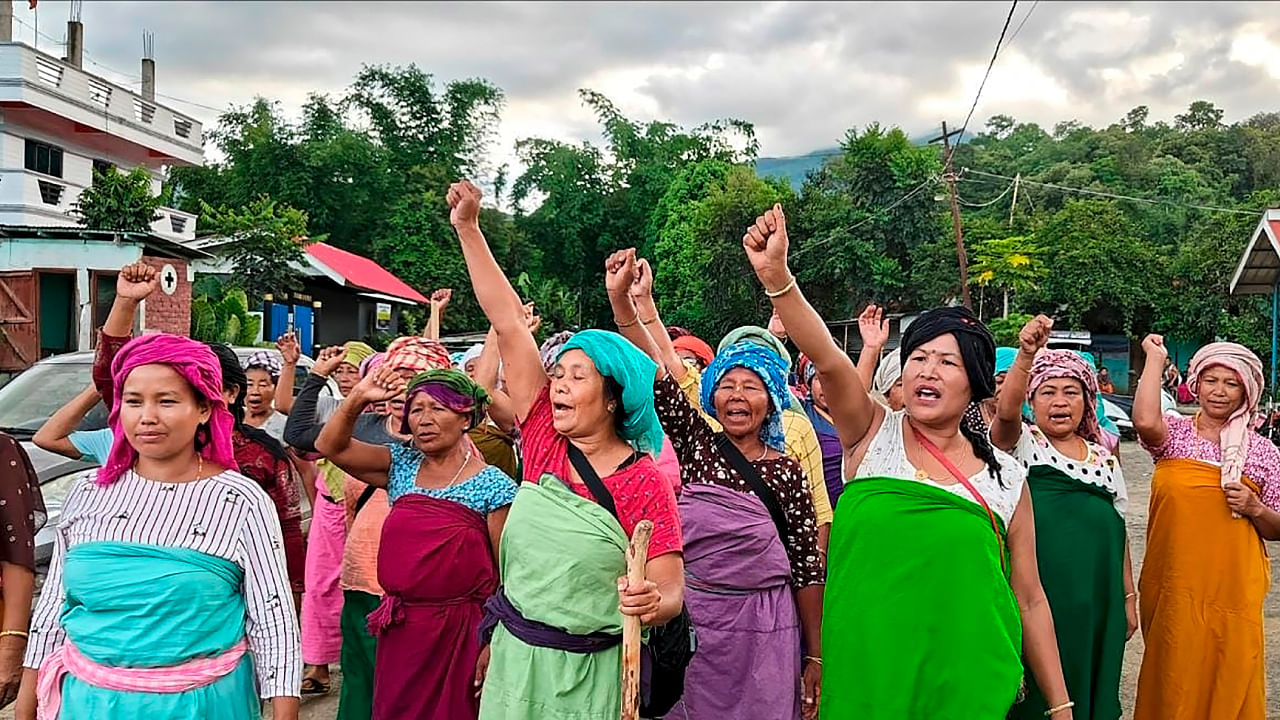 Meitei community women of Kadangband village shout slogans during a protest demanding peace in Manipur, in Imphal. Credit: PTI Photo