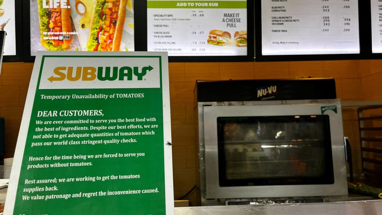 A notice on the temporary unavailability of tomatoes is seen at a Subway outlet at an airport terminal in New Delhi. Credit: Reuters Photo