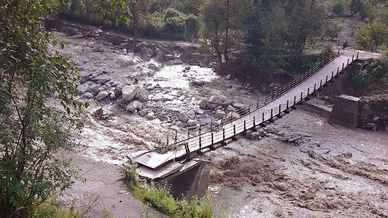  A portion of a bridge damaged due to a cloudburst during monsoon season, in Gadsa valley in Kullu district. Credit: PTI Photo