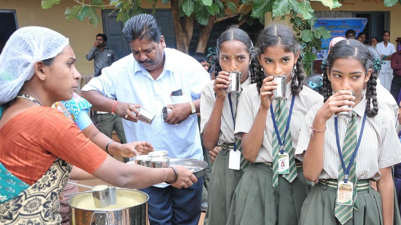 Students in classes 1 to 10 in government and aided schools get milk under the Ksheera Bhagya scheme, five days a week. DH File Photo