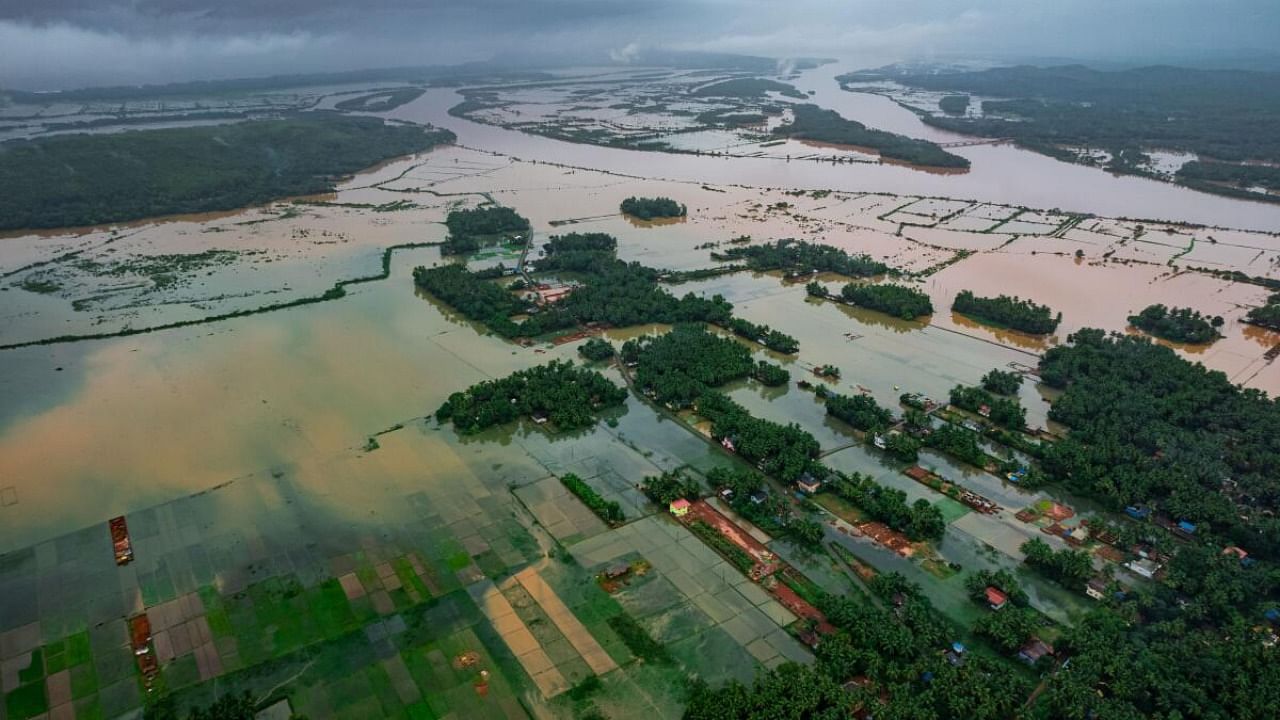 Vast tracts of agricultural land in Manaki, Deevagi and Hegade villages of Kumta taluk in Uttara Kannada district are flooded by waters of swollen River Aghanashini, following incessant rains on Monday. Credit: DH Photo