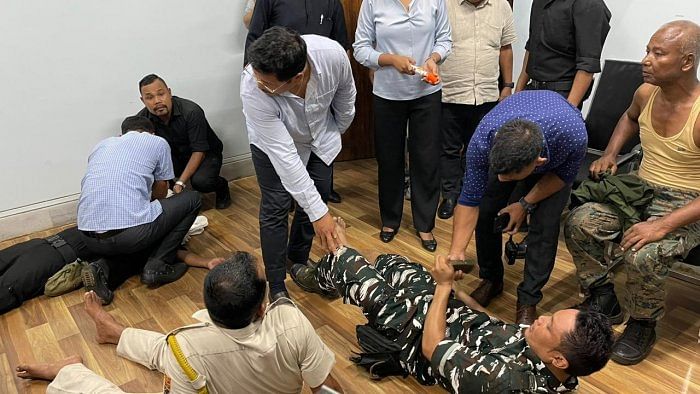 Videos shared by the CM office showed the injured policemen lying on the floors while the CM was seen attending to them. Credit: Meghalaya CMO