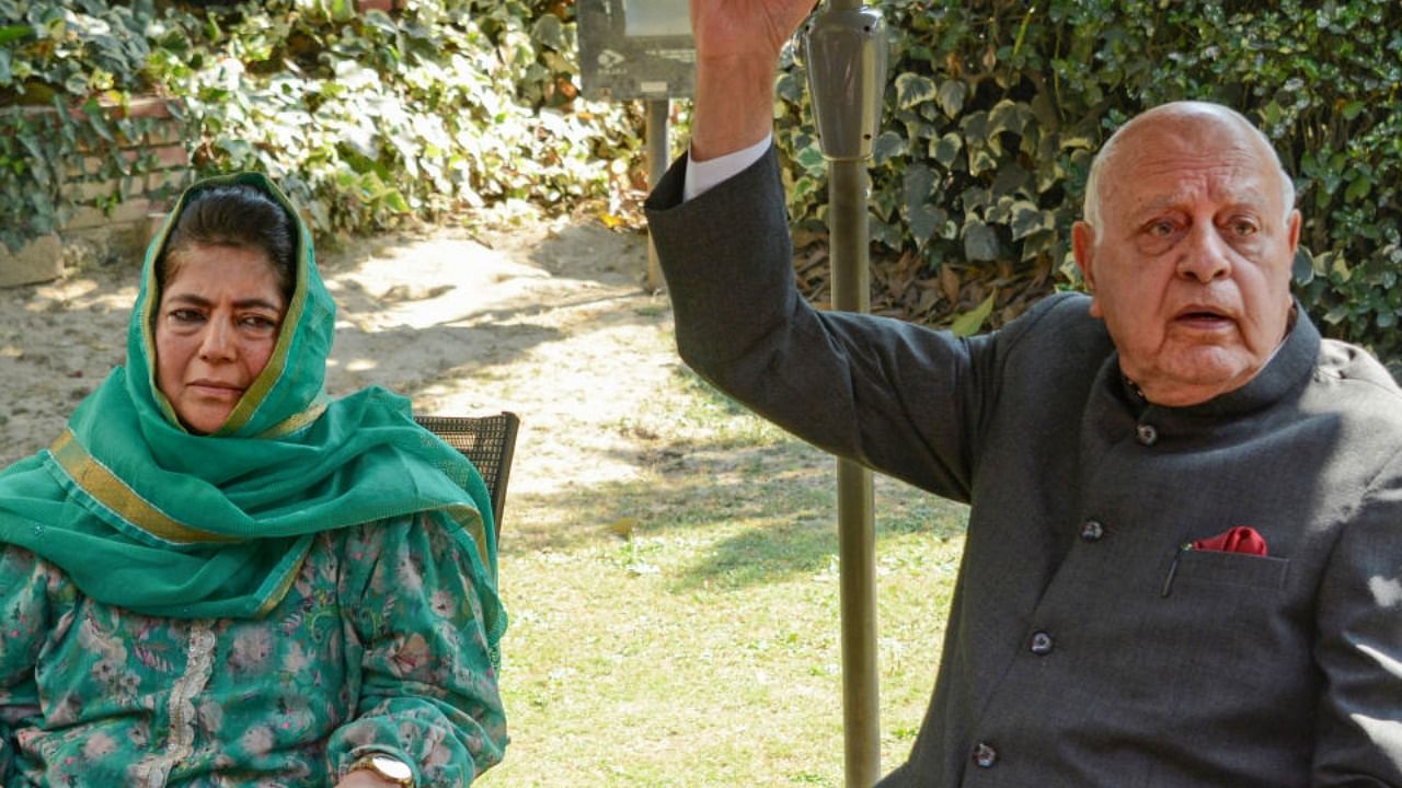 National Conference President Farooq Abdullah with Peoples Democratic Party (PDP) President Mehbooba Mufti. Credit: PTI Photo