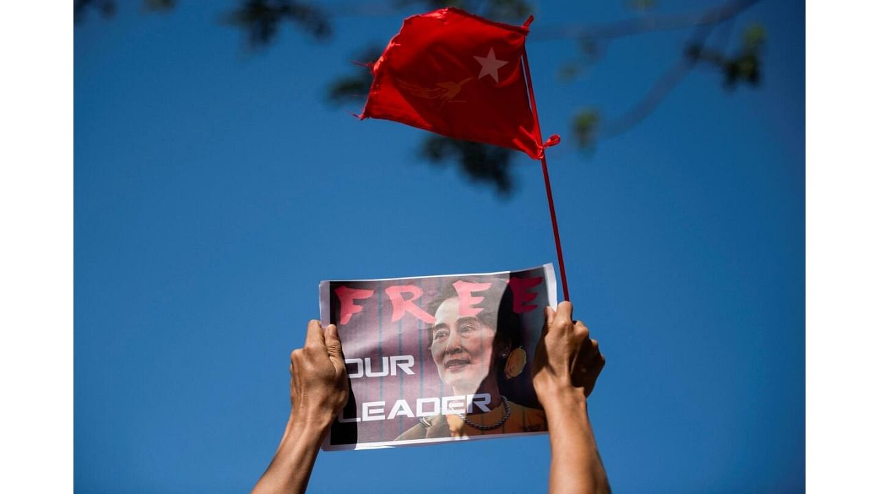 A demonstrator holds up a placard outside the Central Bank of Myanmar to protest against the military coup and to demand the release of elected leader Aung San Suu Kyi, in Yangon, Myanmar, February 11, 2021. Credit: Reuters Photo