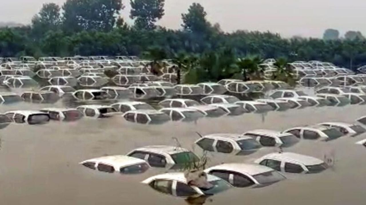 Hundreds of vehicles submerged after the Hindon river flooded many areas, near the Ecotech in Noida, Tuesday, July 25, 2023. Credit: PTI Photo