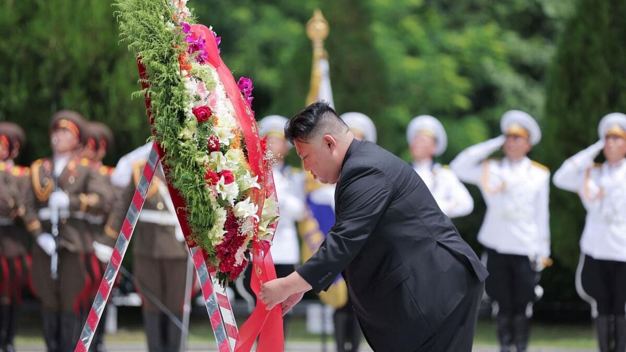 North Korean leader Kim Jong Un visits the Chinese People's Volunteer Army Martyrs' cemetery. Credit: Reuters Photo