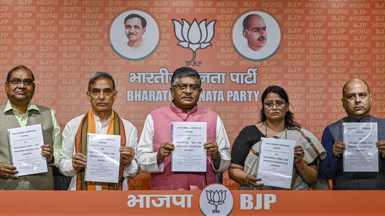  BJP leaders Ravi Shankar Prasad, Satya Pal Singh, Rekha Verma and others release fact finding committee report over violence during West Bengal Panchayat elections. Credit: PTI Photo