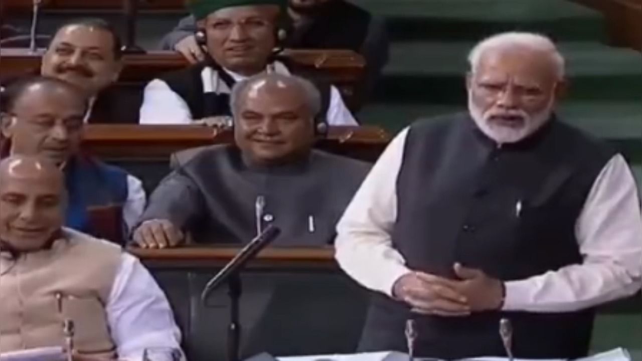 PM Modi from the old video of Lok Sabha. Credit: Twitter / @DDNews