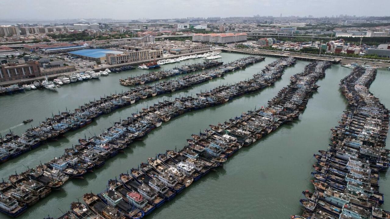 Fishing boats are seen moored at Gaoqi fishing port as typhoon Doksuri approaches, in Xiamen, Fujian province, China July 26, 2023. Credit: CNS Photo via Reuters