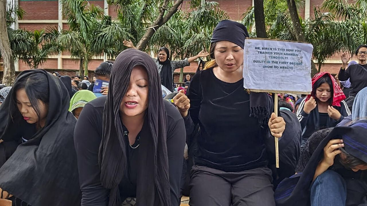 Women from the Zo-Kuki community stage a protest demanding separate administration for Tribals of Manipur, in Churachandpur. Credit: PTI Photo