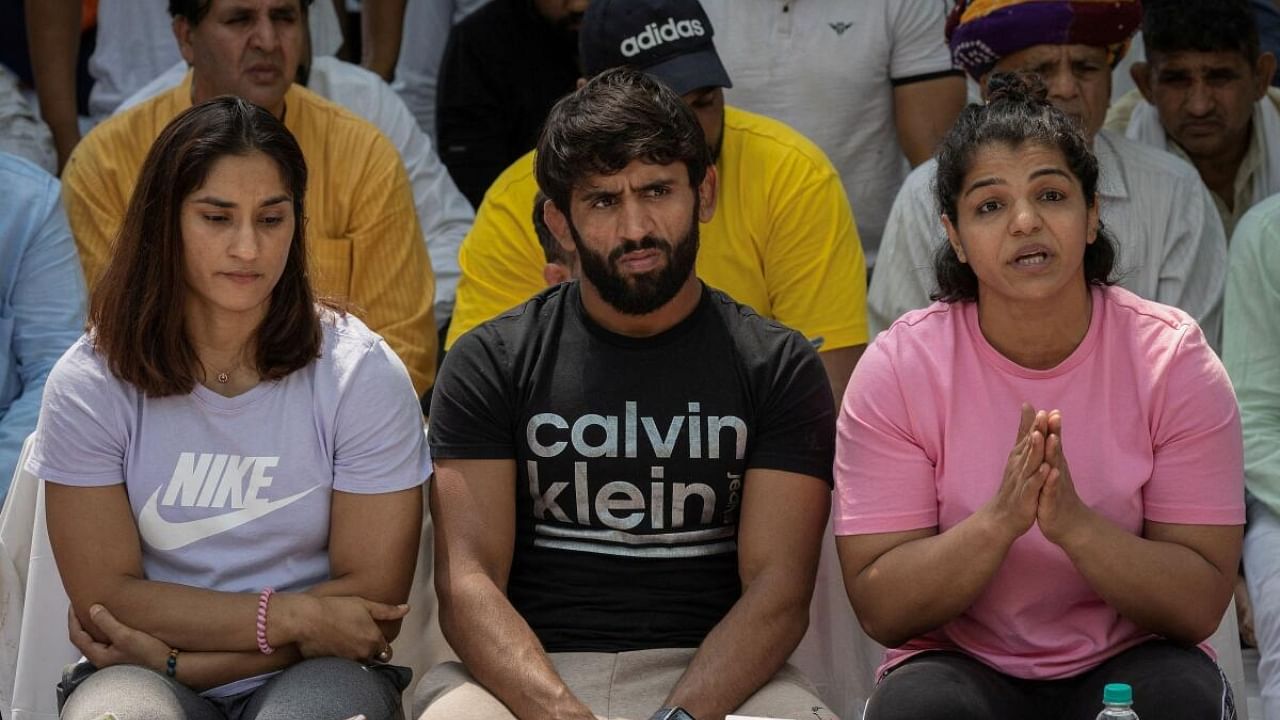 Wrestlers Vinesh Phogat, Bajrang Punia, and Sakshi Malik. Credit: Reuters Photo