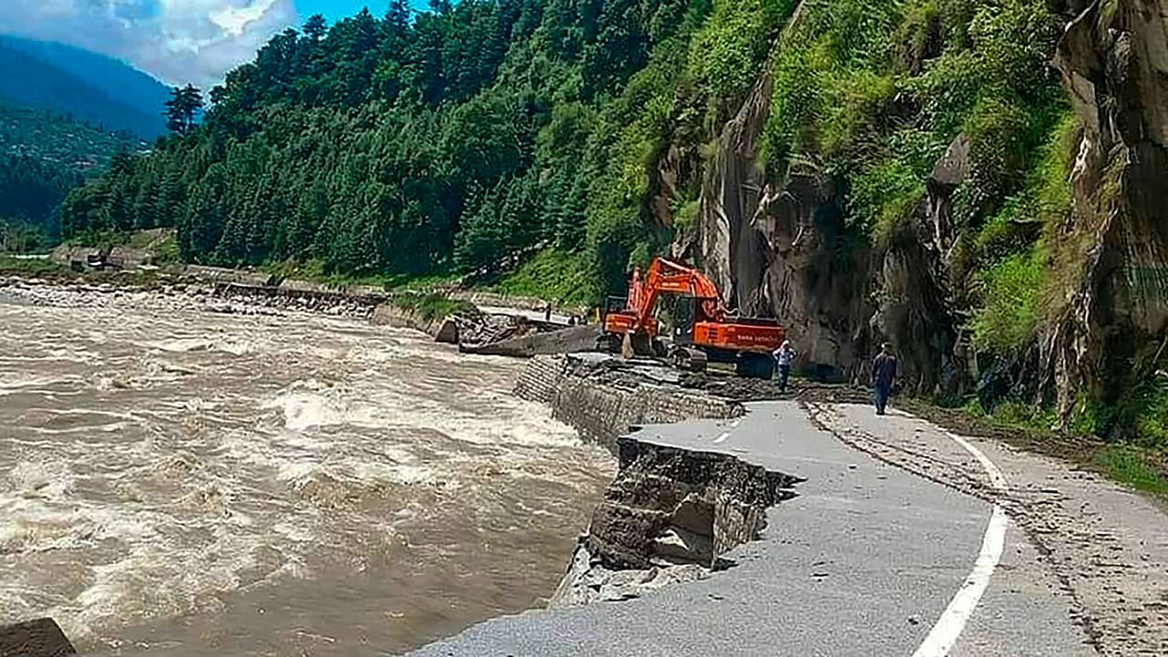 A section of the Kullu-Manali highway washed away in floodwater, in Kullu. Credit: PTI File Photo