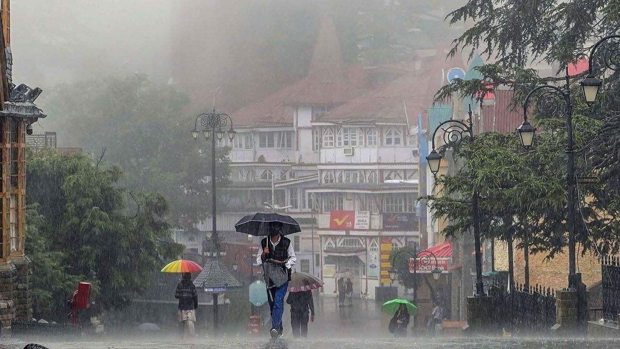 Pedestrians on a road amid monsoon rain in Shimla, Saturday, July 29, 2023. Credit: PTI Photo