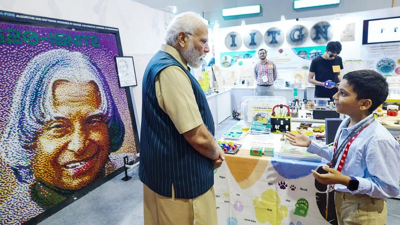 PM Modi visits an exhibition at the inauguration of Akhil Bhartiya Shiksha Samagam, at Bharat Mandapam in New Delhi. Credit: PTI Photo