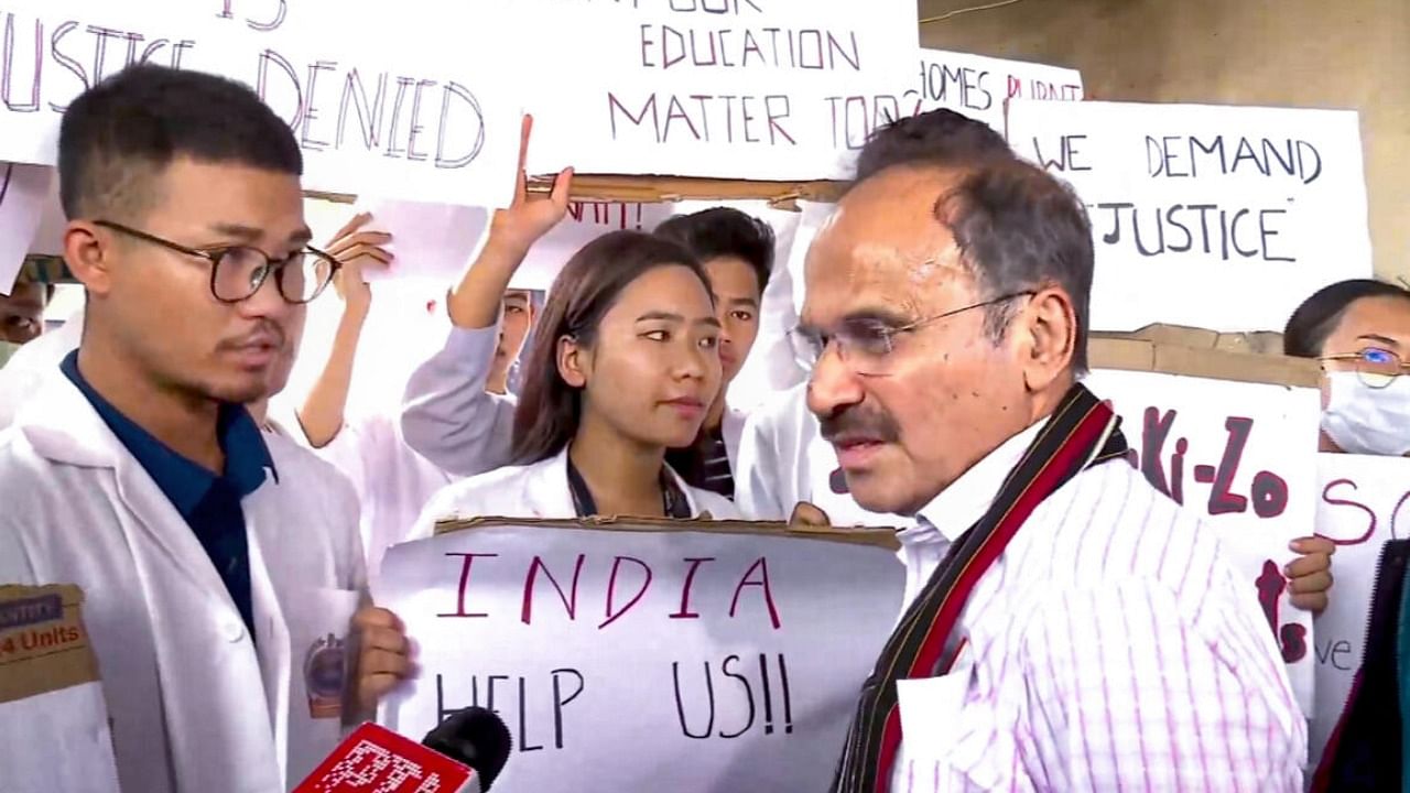 Congress MP Adhir Ranjan Chowdhury interacts with medical students protesting over the ongoing violence in Manipur. Credit: PTI Photo