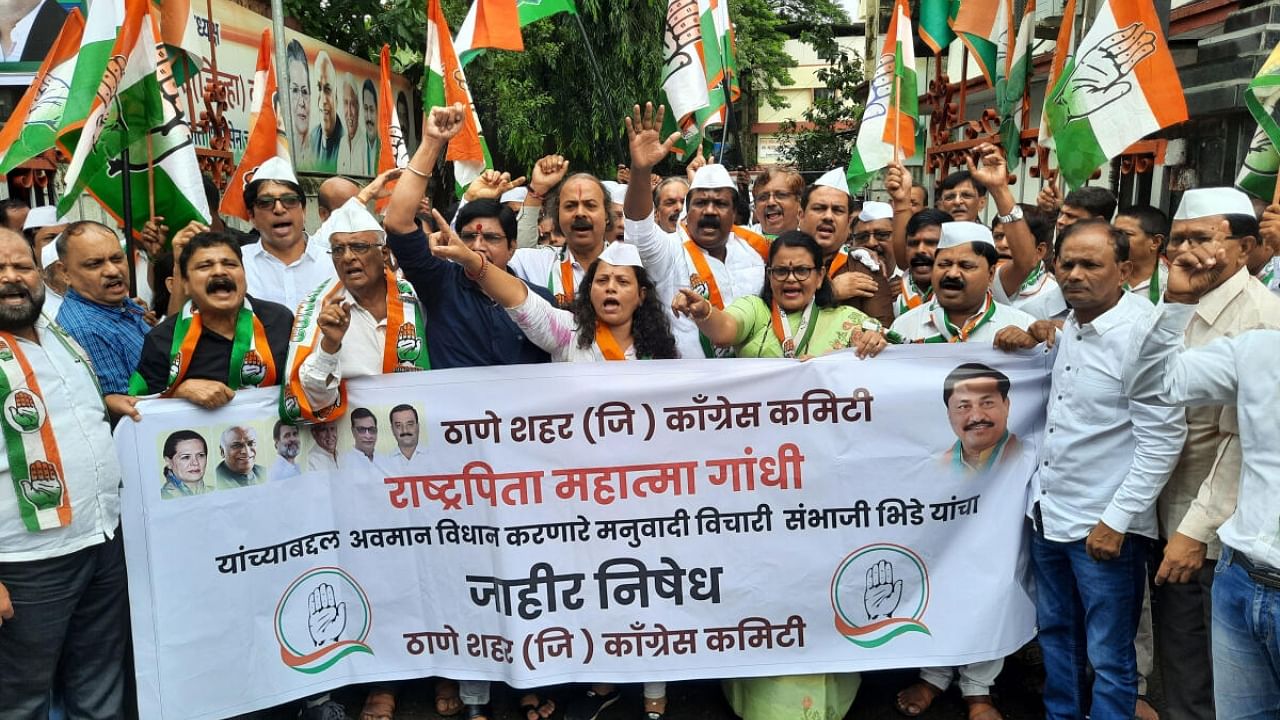 Congress workers raise slogans during a protest against right-wing activist Sambhaji Bhide over his alleged derogatory remarks about Mahatma Gandhi, outside party office in Thane, Saturday, July 29, 2023. Credit: PTI Photo