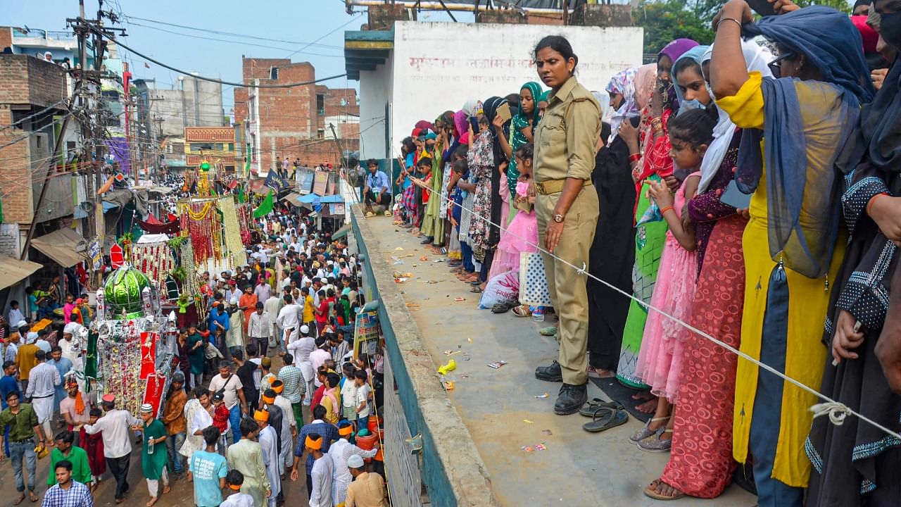 Muslim devotees take part in a religious procession on the tenth day of the mourning period of Muharram. Credit: PTI Photo