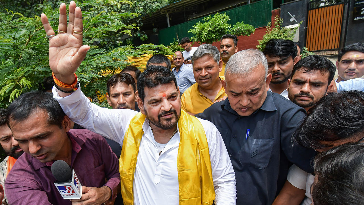 Outgoing Wrestling Federation of India President and Bharatiya Janata Party MP Brij Bhushan Singh shows support for his candidates as they leave for federation polls, at Jantar Mantar in New Delhi. Credit: PTI Photo