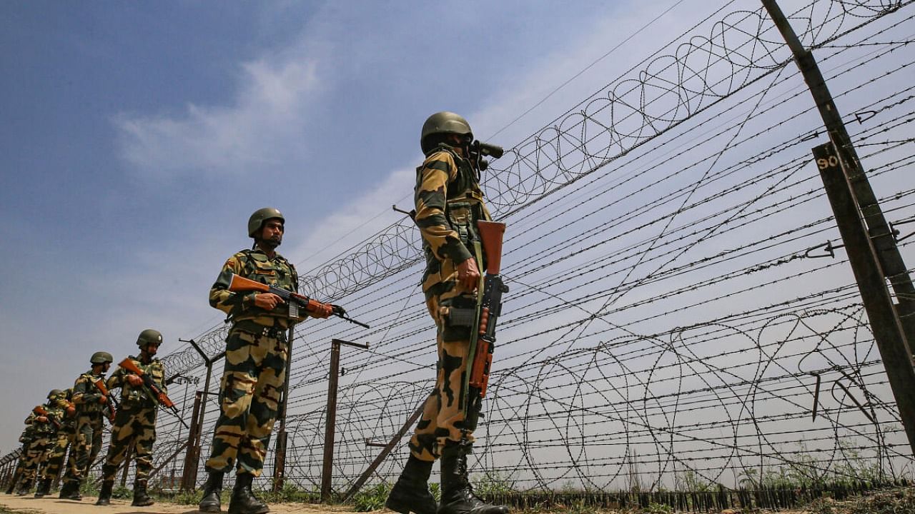  Border Security Force (BSF) personnel patrol near the international border. Credit: PTI File Photo