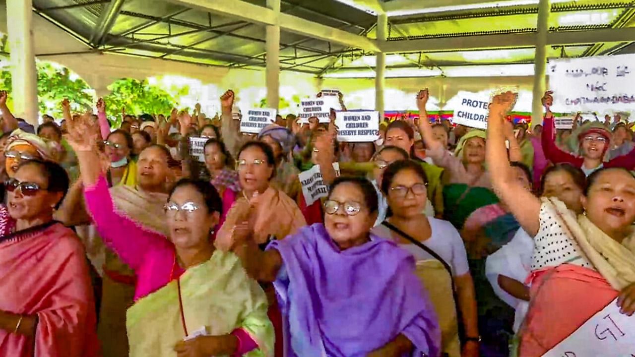 Women protest against the recent videos showing two women being paraded naked by a mob in violence-hit Manipur, in Imphal, Friday, July 21, 2023. Credit: PTI Photo