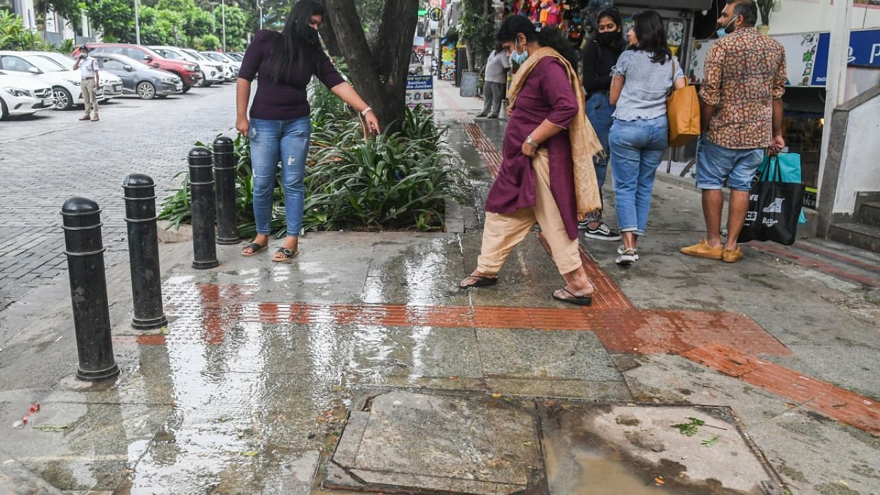 The party pointed out that the heavy flow of sewage in the last six months has not only raised a stench, but is a nuisance to walkers and traders alike. Credit: Special Arrangement