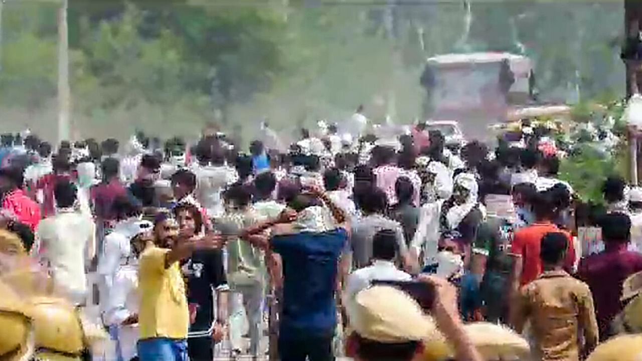 People during the 'Brij Mandal Jalabhishek Yatra', in Nuh, Monday, July 31, 2023. Stones were pelted during the procession and cars were set on fire. Credit: PTI Photo