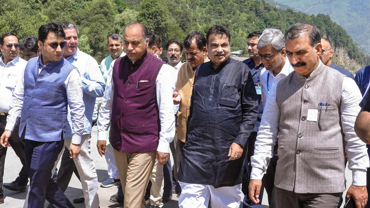 Union Minister Nitin Gadkari and Himachal Pradesh Chief Minister Sukhvinder Singh Sukhu with former CM Jai Ram Thakur arrive to inspect road damaged due to floods, in Kullu, Tuesday, Aug 1, 2023. Credit: PTI Photo
