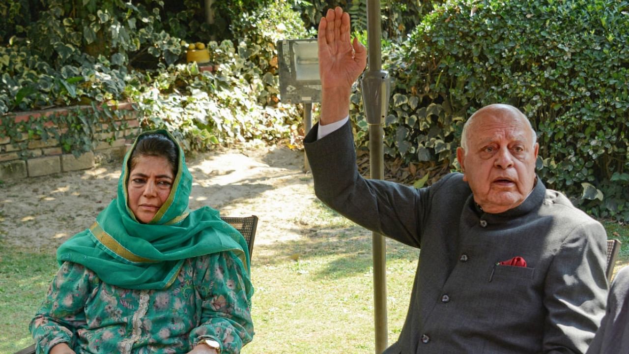 National Conference President Farooq Abdullah with Peoples Democratic Party (PDP) President Mehbooba Mufti. Credit: PTI Photo