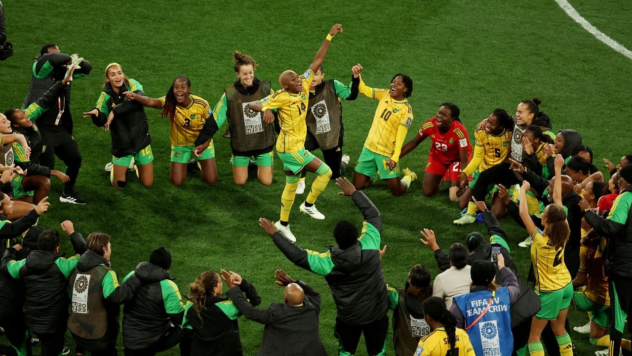 Jamaica's Deneisha Blackwood celebrates with teammates after the match as Jamaica qualify for the knockout stages of the World Cup. Credit: Reuters Photo
