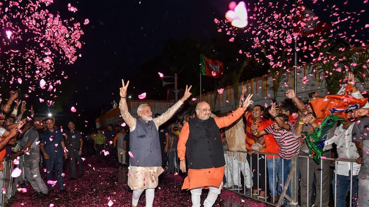 BJP workers welcome PM Narendra Modi and Home Minister Amit Shah after the 2019 Lok Sabha poll results. Credit: PTI File Photo